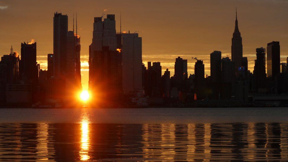 View of Manhattan skyline at sunset.